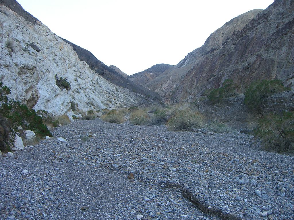 Notice the shift in the color, with the left side canyon wall and hillside being covered by white rock: