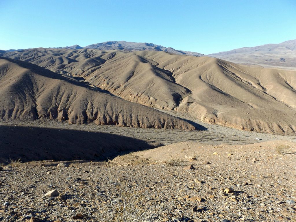 The next few pictures show the difficult crossover route into Jalopy Canyon.  Here I have started climbing the northern ridge and am looking back toward the main canyon containing Tucki Mine Road and the side fork which is Telephone Canyon.  Notice the vehicle is parked down below in the same location for both hikes: