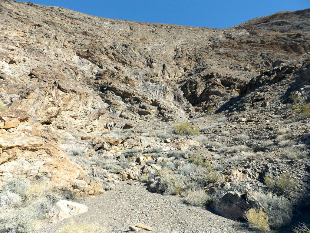 Passing through a fairly open section of canyon with high hillsides all around: