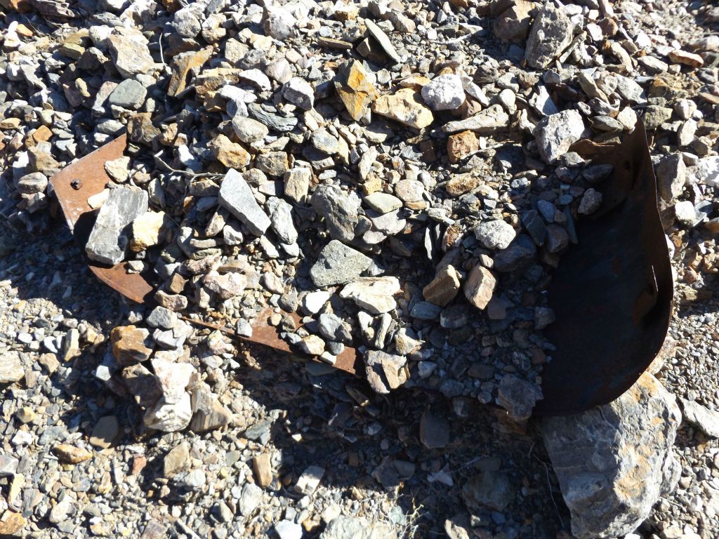 As seen in the next two pictures, the metal car pieces are slowly being buried by gravel: