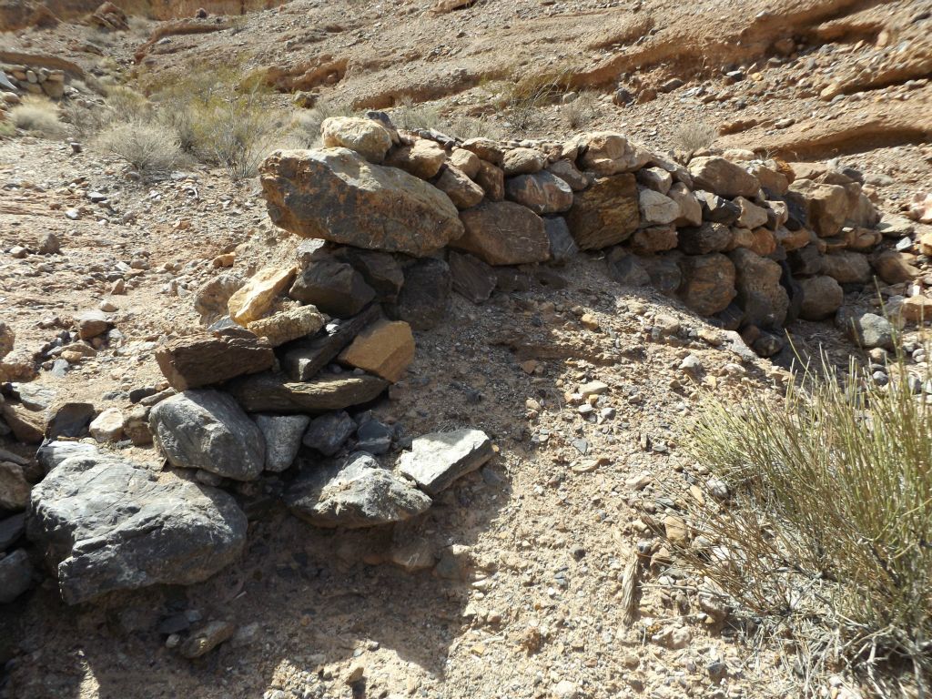 These small rock walls are also known as tailing dams, built for blocking off water which once flowed through this area: