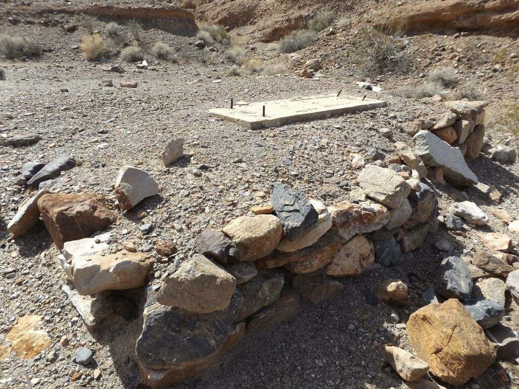 Foundation walls made of rock supporting a leveled terrace: