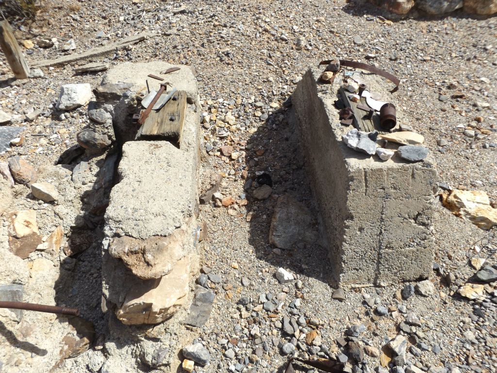 Concrete blocks (or pilings) which are rising up from the ground: