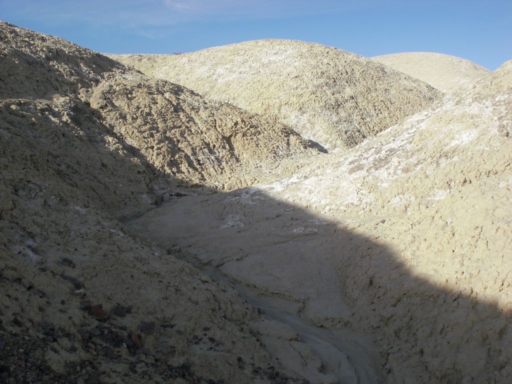 Hiking up through a small drainage in the Salt Creek Hills.  The ground was soft and progress was slow: