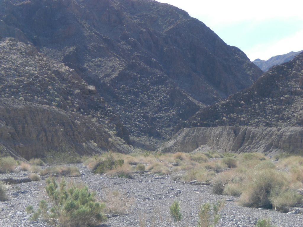 Once inside the canyon, fluted mud cliffs begin to appear at various places.  Here, they are at the base of the mountainside: