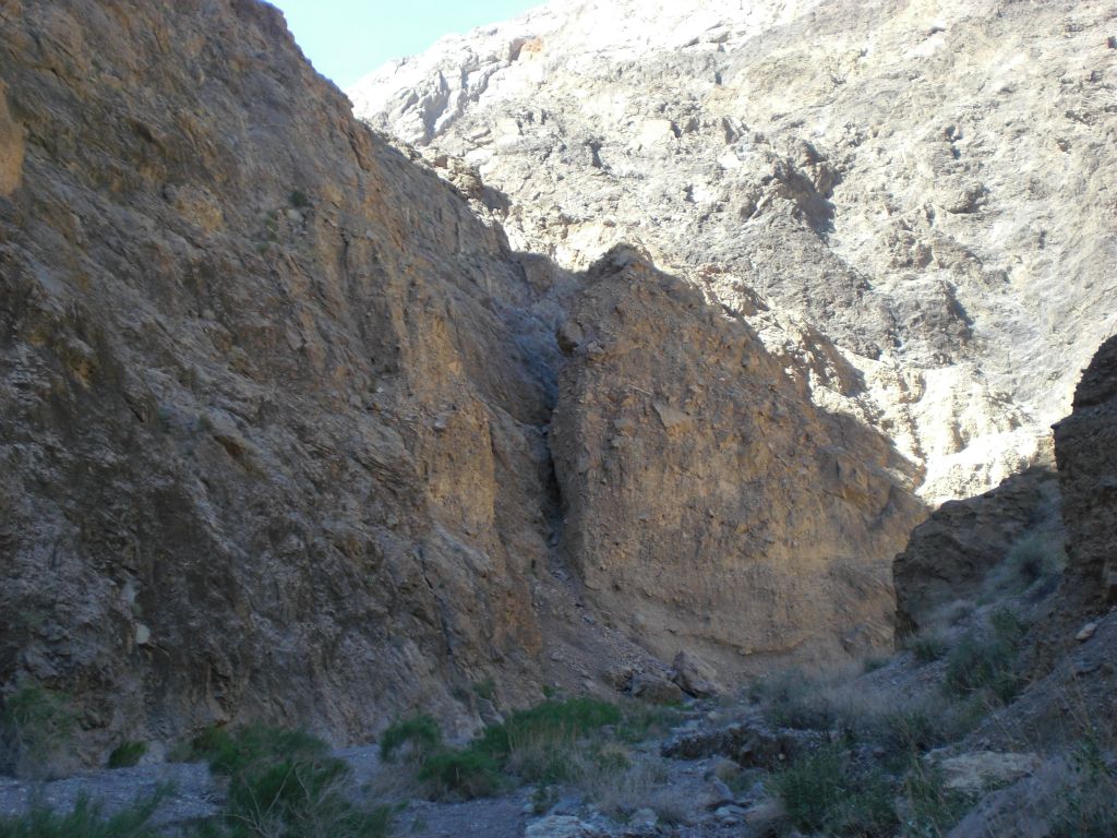 The sun shining brightly on the canyon wall in the distance: