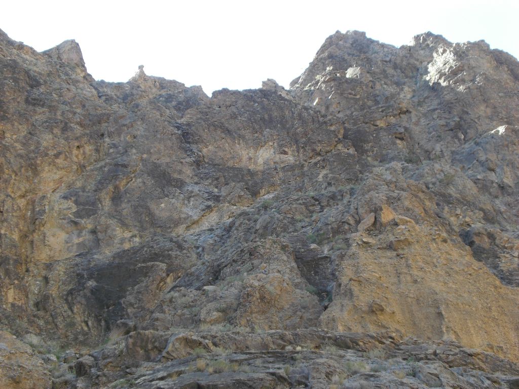 High up on the hillside, there were small pinnacles and rocks of varying sizes looking like they were ready to tumble over: