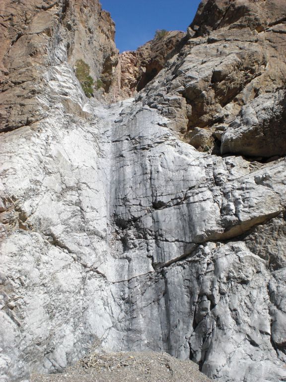 And this is the 15 foot dry fall which must be climbed in order to continue hiking up canyon.  I was able to get most of the way up, but decided that the last move was too risky to try.  Besides, I didn't want to keep Daria waiting as she was stranded back in the middle of the 1st Narrows: