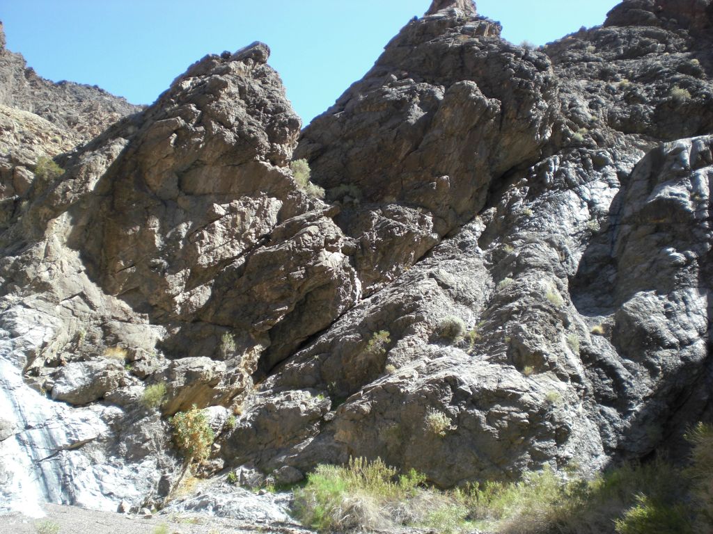And finally, the hike ended here, in what I call the Trellis Room.  In this room, you are enclosed by cliffs.  There are three dry falls in here, which is a rarity in the park.  In this picture, you can see a dry fall to the far left and far right: