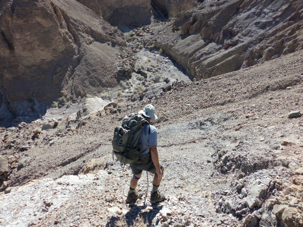 The rocks were loose and the terrain was steep.  Later, we realized that we should have gone farther around the hills on the sheep trails and the descent would have been easier: