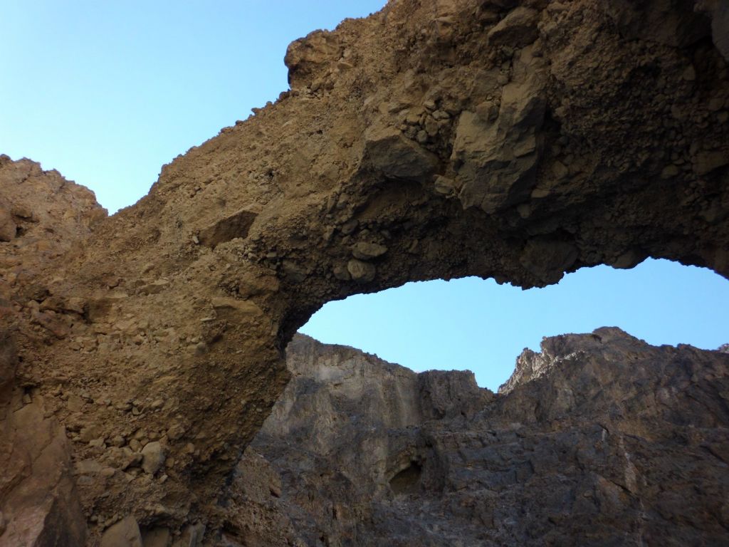 A cool view of the bridge with the gorge walls rising high above it: