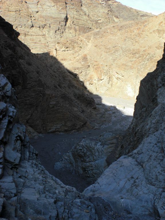 And this is looking back down Lower Mosaic Canyon.  In the distance, you can see the bypass trail which leads up to the Mosaic Rim Trail junction.  I had been standing below this major dry fall less than an hour earlier:
